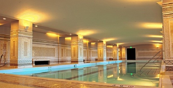 The pool deck and walls in the spa area were installed with mosaic tiles, and larger tiles in the treatment rooms.