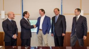 Mr. Luigi Di Geso, President and CEO of MAPEI Americas shaking hands with Mr. Travis Collins, General Manager of GRT