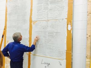 NTCA Recognized Consultant Richard Goldberg of Procon International examines mortar coverage at Crossville, as tile industry leaders work on installation standards for thin porcelain tile.