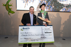 BOSTIK'S MIKE JENKINS PRESENTS DNG GRAND PRIZE AWARD TO MURAL DESIGNER NICOLE KOHRI. SHE'S GOING TO PARIS!