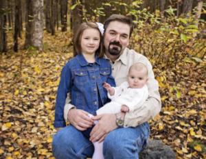 Don Hutcheson with daughters (l. to r.) Elizabeth, now 6 and Emma, now 2. The new addition to the family this year is Evelyn, born May 17.