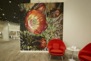 A floor-to-ceiling desert cactus mosaic mural welcomes visitors to Daltile’s Las Vegas tile and stone gallery.