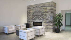 The Daltile Denver showroom features a fireplace vignette with four book-matched slabs.